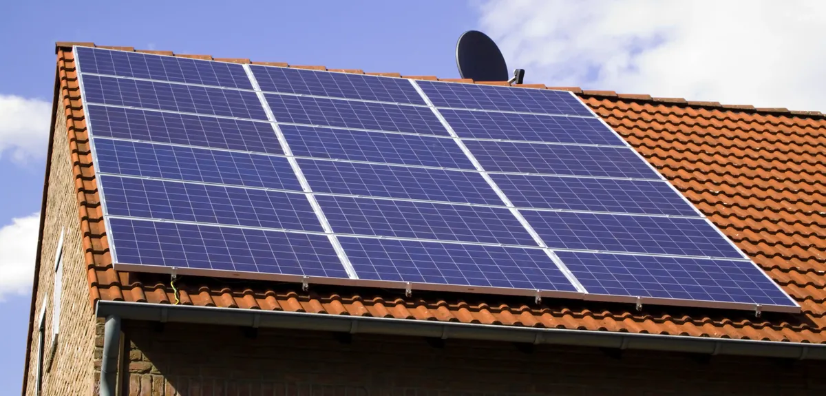 Solar panels installed on a pitched tiled roof.